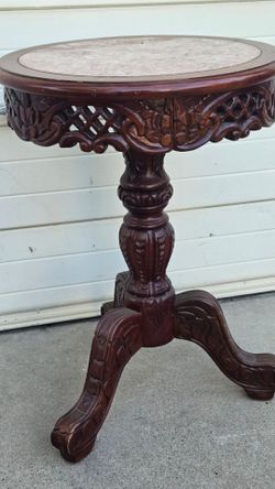 Carved end table 3ft tall with marble top