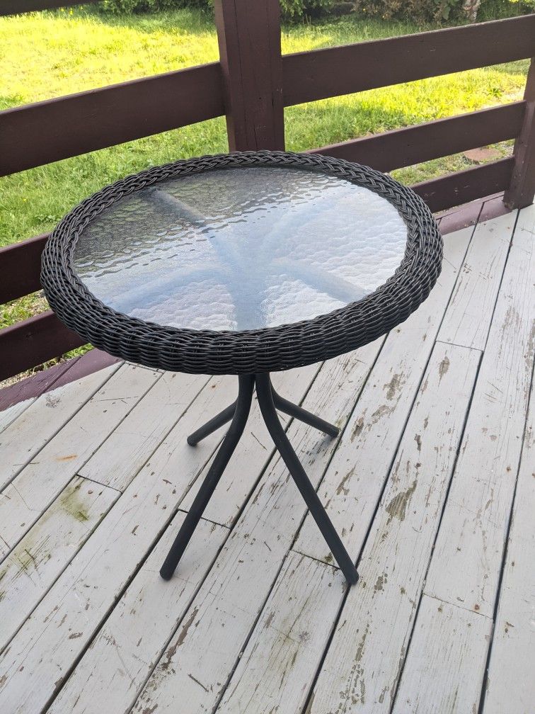 Beautiful Outdoor glass bistro table dark brown.
2 feet wide, 29 inches tall.
 Revere