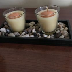 Zen candles with colorful pebbles
