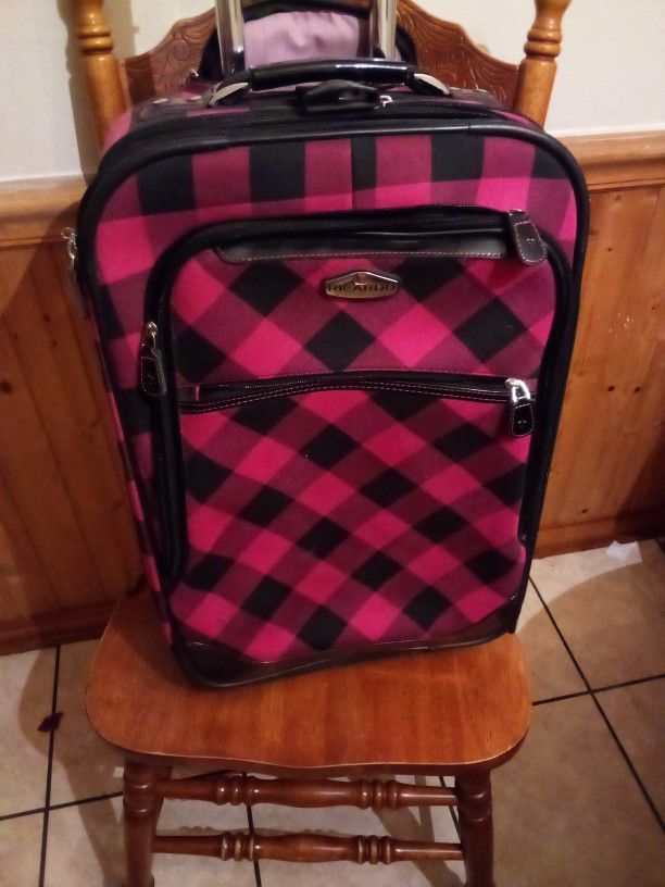 Gorgeous Red and black plaid Ricardo Beverly Hills 24 "tall rolling carry on luggage. PERFECT Condition. Handle adjustable to 2 different heights 10"