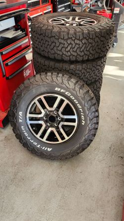 Ineos Grenadier BFG KO2 AT Tires and OEM 17 inch  Alloy Wheels