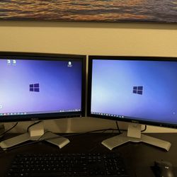 Two Dual 21”  Dell Monitors (Black with silver Adjustable Height Stands)