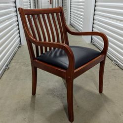 Wood Armchair with Black Faux Leather Cushioned Seat. 