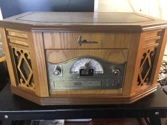 Emerson 4-in-1 Mini Stereo System Turntable AM/FM CD & Cassette Player  This Emerson NR303TT 4-in-1 Mini Stereo System is a versatile piece of equipme