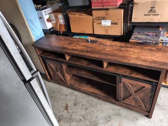 Dark brown barn style entertainment center