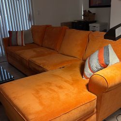 Orange Sectional Sofa With Additional Section In Storage