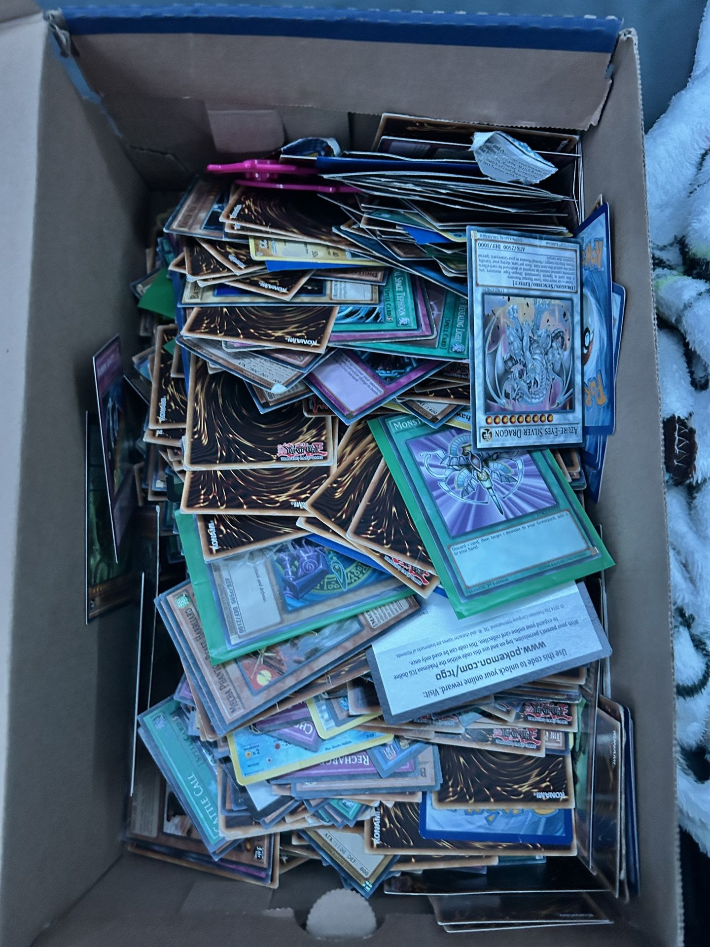 Box full of yugio and some Pokémon cards