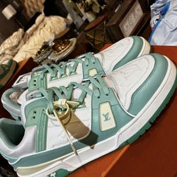Louis Vuitton LV Trainer sneakers in a white and "Tiffany" mint green colorway