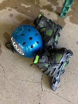Size 4 rollerblades with helmet