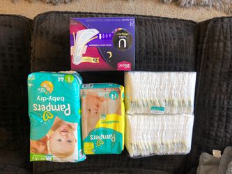 UNOPENED Pampers size Newborn and Size 1 Diapers, plus unopened Kotex Overnight