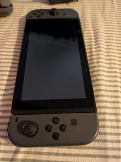 Nintendo Switch Console with Gray Joy-Cons and smash bros
