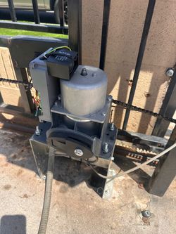 Electric gate shaking, dragging, or jamming? I fix chain, rollers, and tracks
