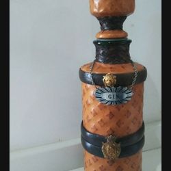 Leather-lined bottle, 12 inches tall.  very nice design.