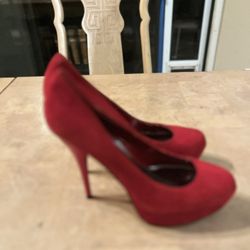 Bright red suede stiletto style heels