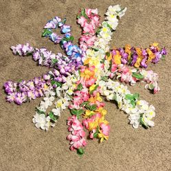 Hawaiian lei’s (21), 7 Head pieces, 14 wristlets