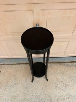39in Black two-tier English ebonised wood plant stand features graceful curved legs and a circular top.