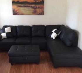 Black leather sectional couch and ottoman