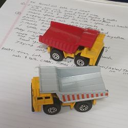 2 Marchbox Dump Trucks....1/64th Size