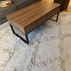 Coffee table with lift top