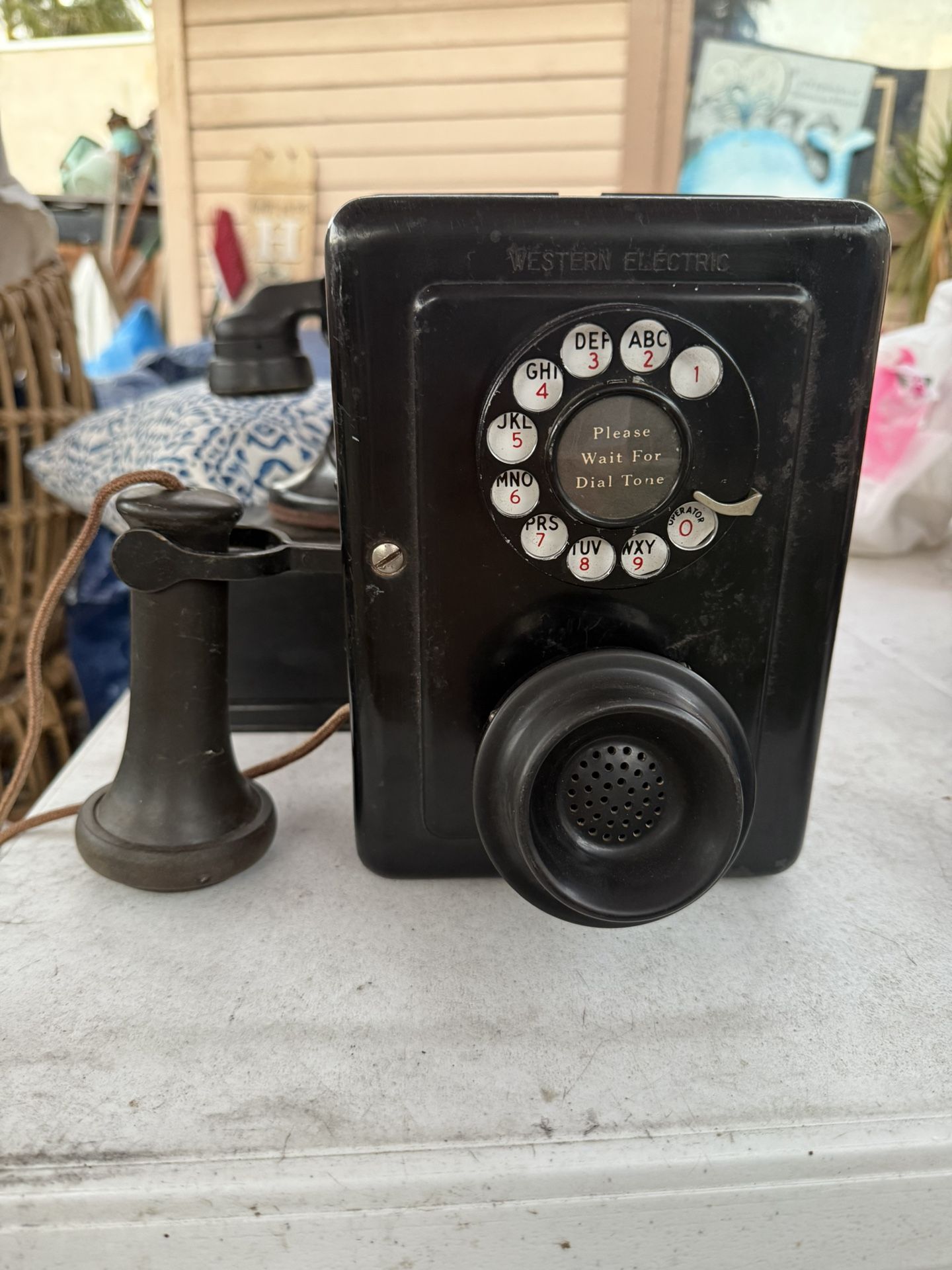 Western Electric 653 Metal Wall Phone, a vintage rotary dial telephone.