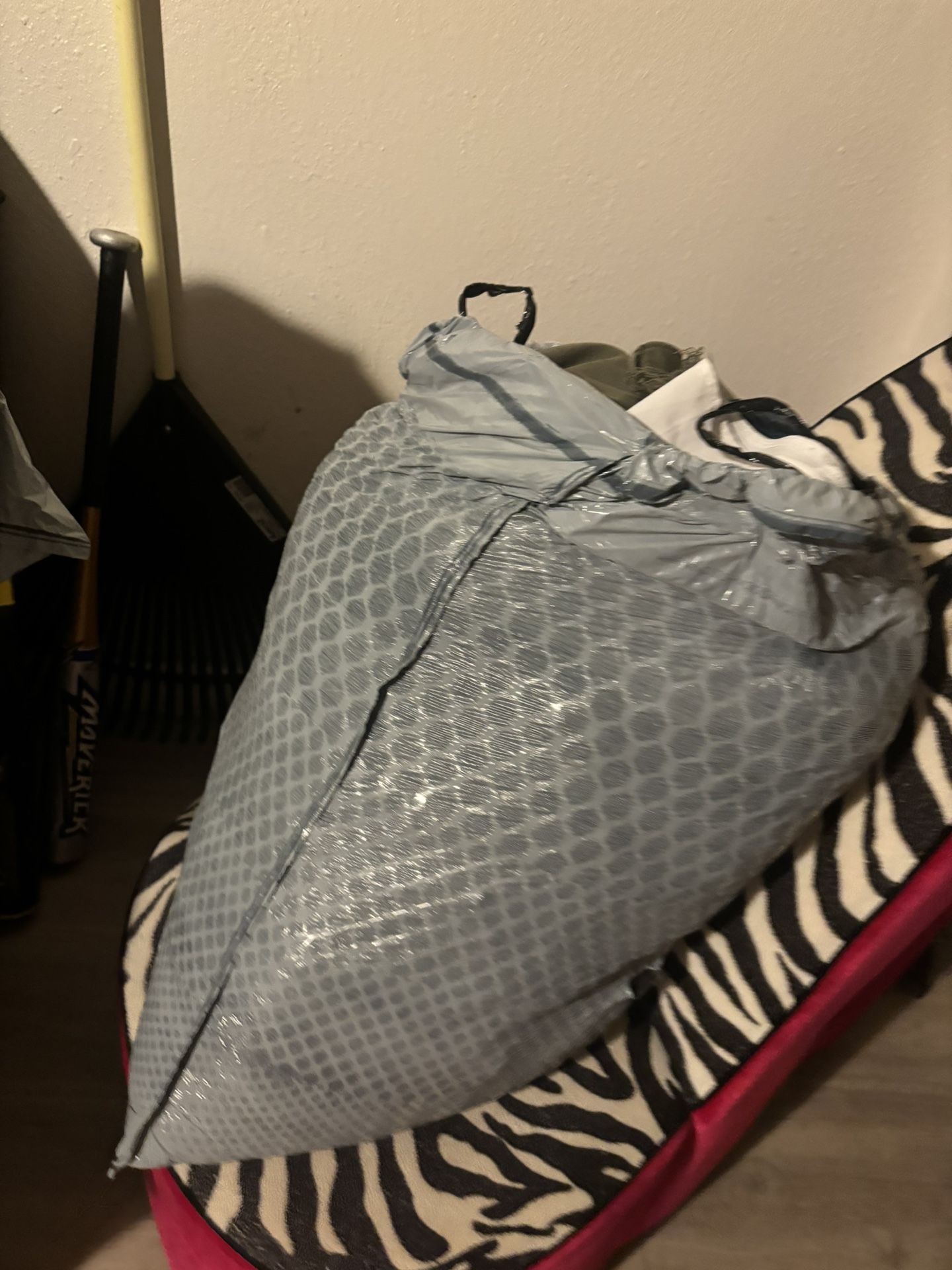 2 large bags of assorted clothing in medium size (maximum 40 pieces) and a pair of lightly used NB size 5.5 tennis shoes And Two  Handbags