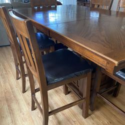 Dinning table with 6 counter high chairs and bottom storage