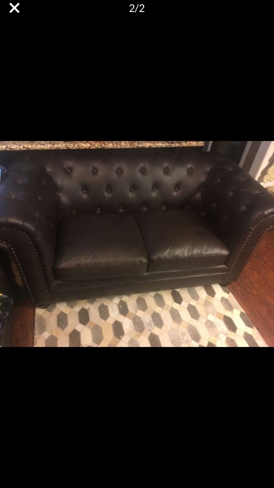 Tuffted brown sofa and loveseat
