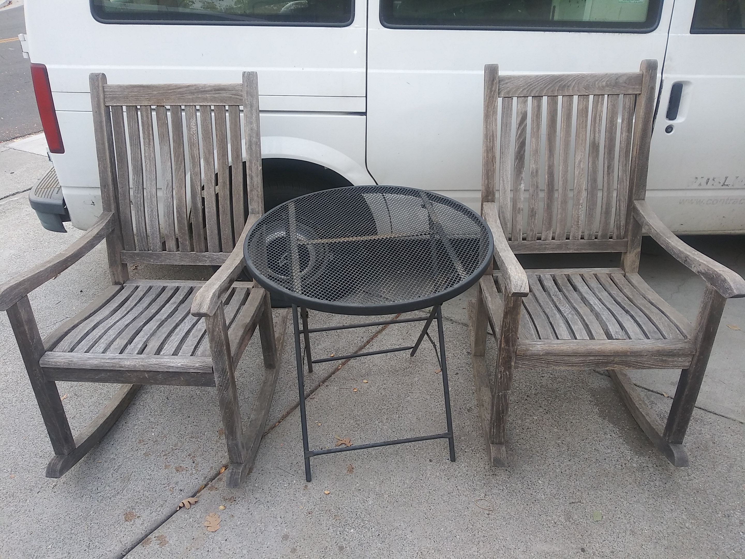 Brazillian Iron Wood outdoor patio rocking chairs and metal table