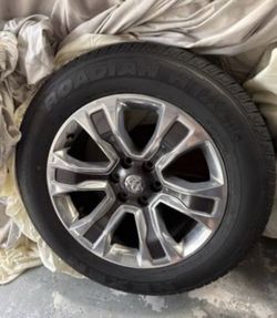Complete set 20” Ram 1500 limited rims and tires