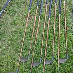 Vintage golf clubs, balls, bags