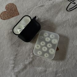 Air Pod Pros With Black Case And Ear Pieces