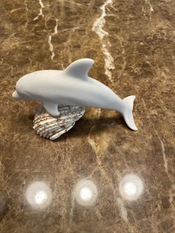 Dolphin on a shell decor