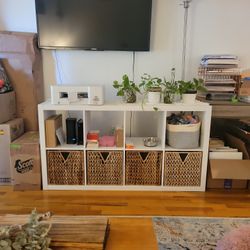 TV console with wicker baskets