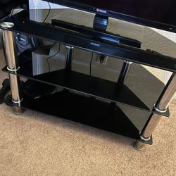 Black Glass TV Stand with Chrome Legs – Sleek & Sturdy