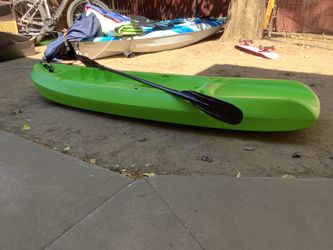 Green kids kayak and Patel