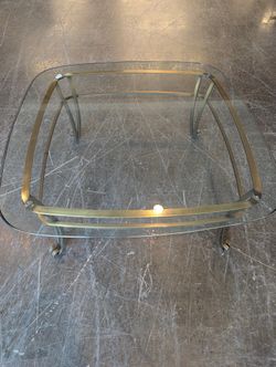 Sophisticated Glass Top Coffee Table with Brass Frame