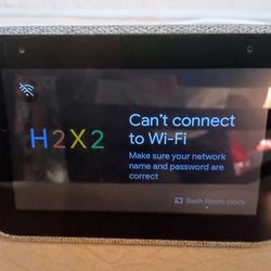 Lenovo Smart Clock, a compact voice-controlled smart alarm clock featuring Google Assistant.