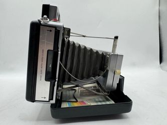 Assorted vintage and newer camera items