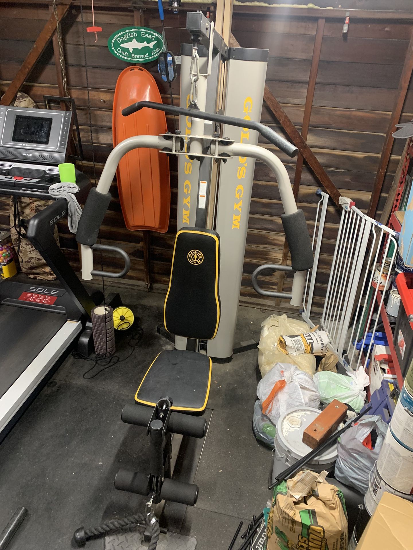 Gold’s Weight Stack Machine With Upper and Lower Pulleys.