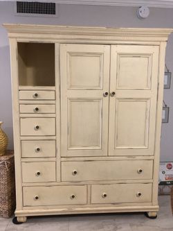Vintage Armoire with Push-in Doors.