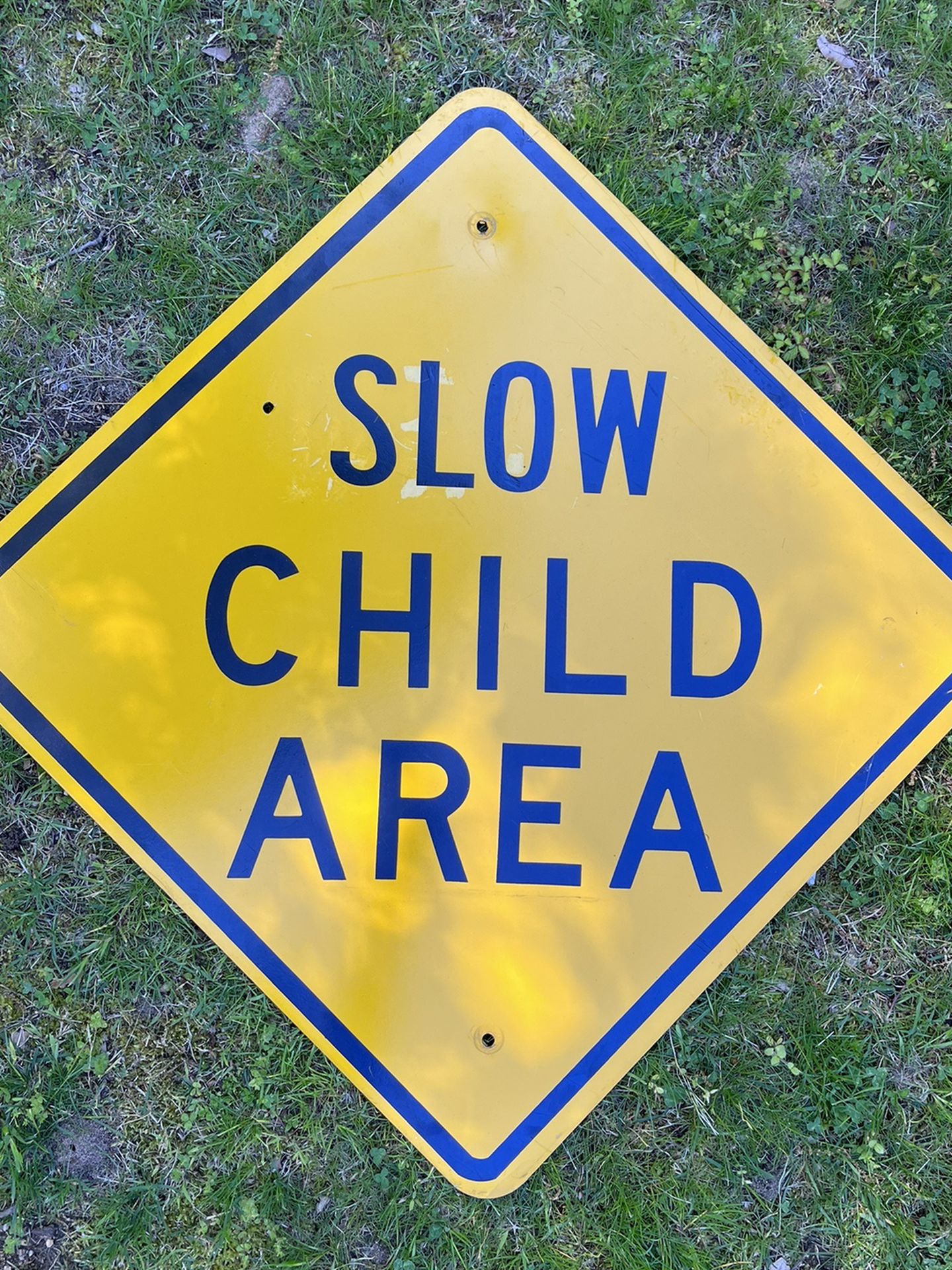 Old Vintage Discarded Metal Street Sign Diamond Slow Child Area Yellow