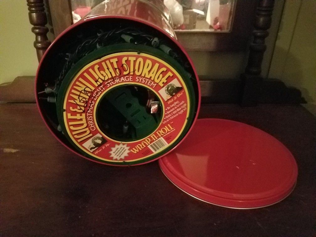 Christmas lights; four rolls of 100 lights and red storage container; multicolored - -$5