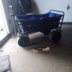 Big Wheel Wagon In Good Condition Is Blue Next