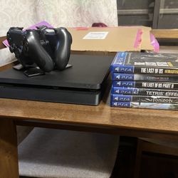 PS4 Slim 1TB/Two (2) Controllers + Charging Dock/Six (6) Games 