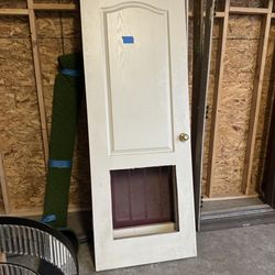 Door with opening for grill