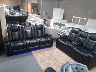 Power reclining sofa or love seat with adjustable headrest