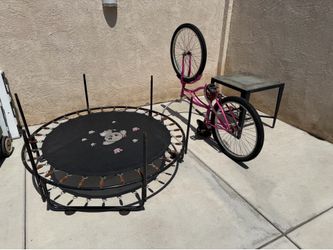 Free trampoline, bicycle and outdoor table.