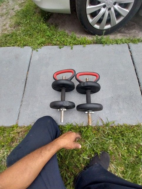 Dumbbells With Weights And A Set Of Push Up Handels.