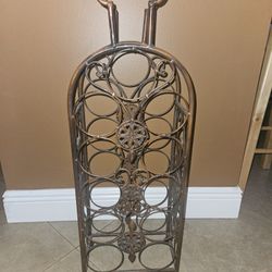 WINE RACK. 11 BOTTLE CAPACITY.  30 INCHES TALL BY 10 INCHES WIDE. Classy artistic Wine rack