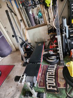 Golds Gym XR5 Weight Bench With Olympic Bar, Leg Curl Attachment And Weights